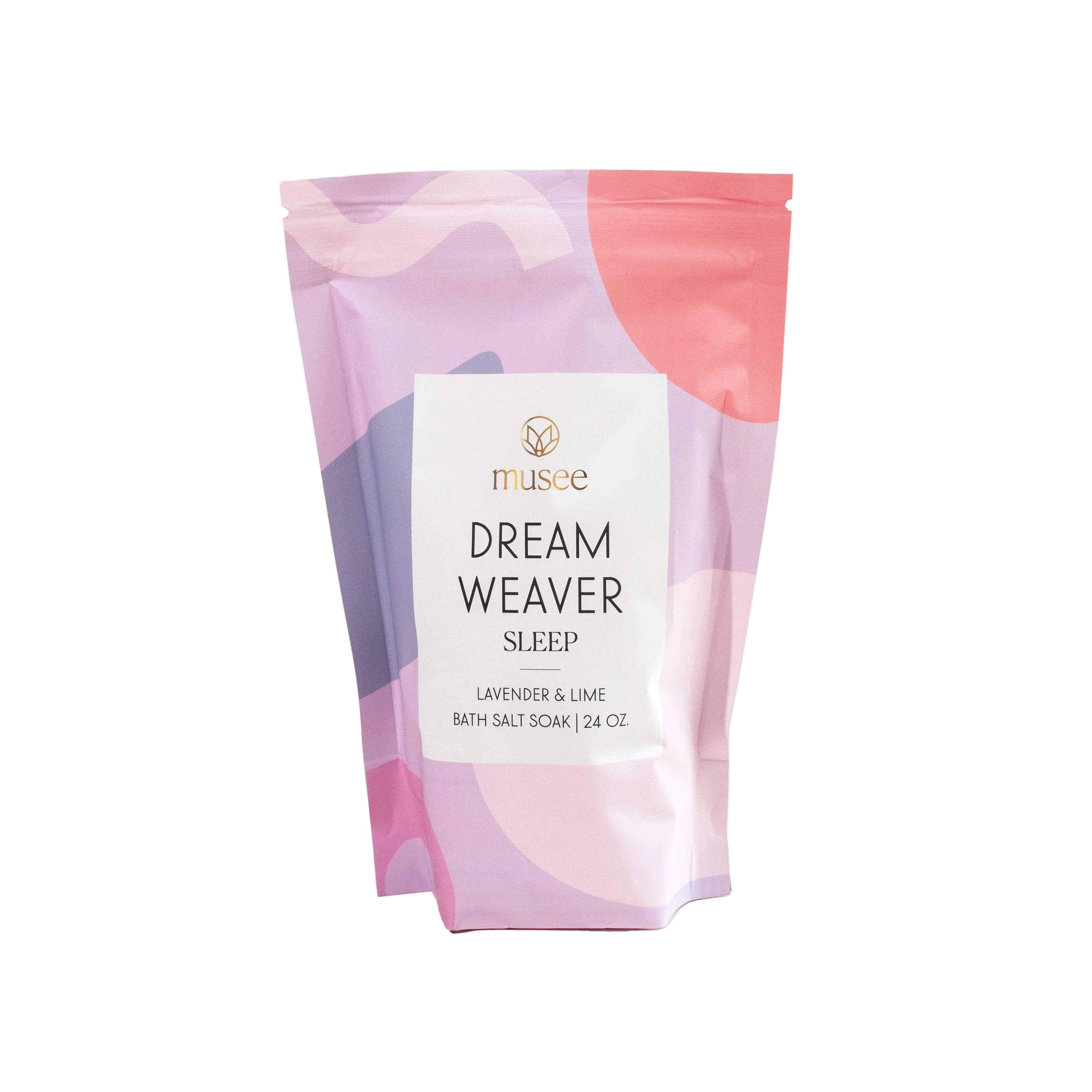 A package of Musee brand Dreamweaver Sleep bath soak with chamomile and lavender fragrance, featuring a colorful design with circles and a nighttime scene.